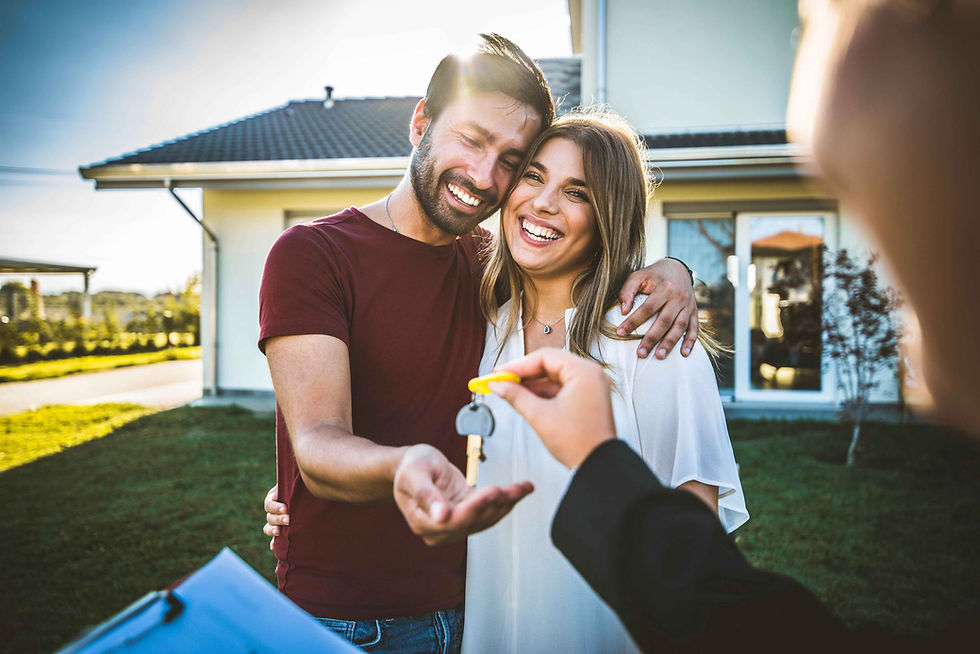 Family collecting the keys for their first home