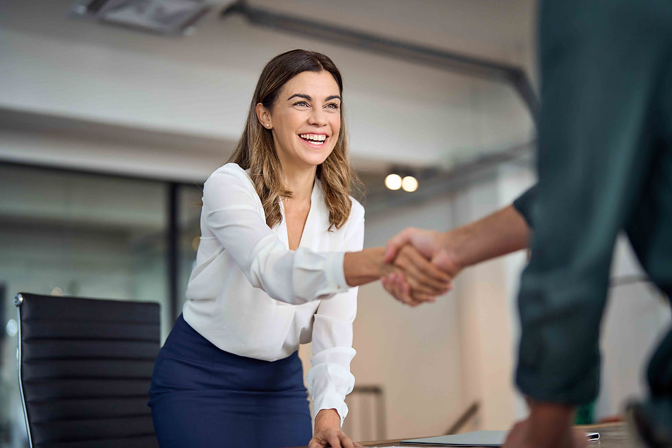 Woman shaking hands after completing the first home purchase process